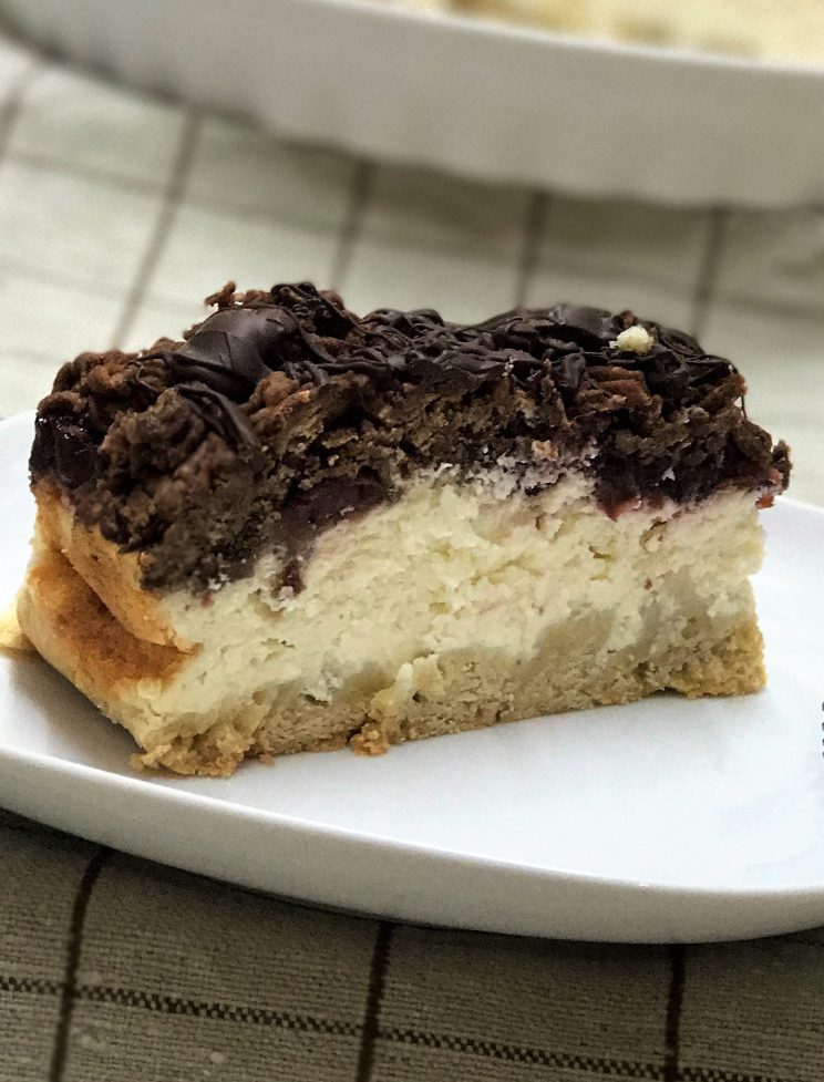 cherry vanilla mousse cheesecake with chocolate and vanilla cookie